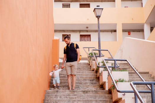 Parent guiding toddler to the potty