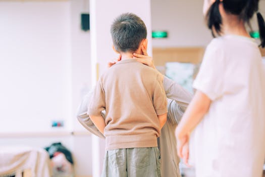 supportive daycare staff assisting children