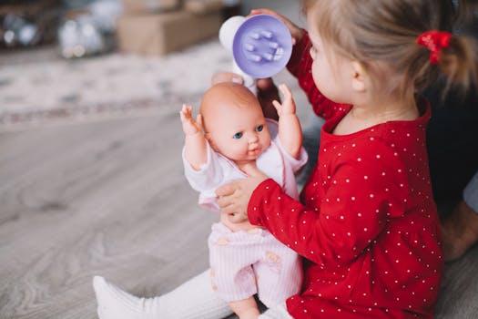 toddler playing with a potty training doll