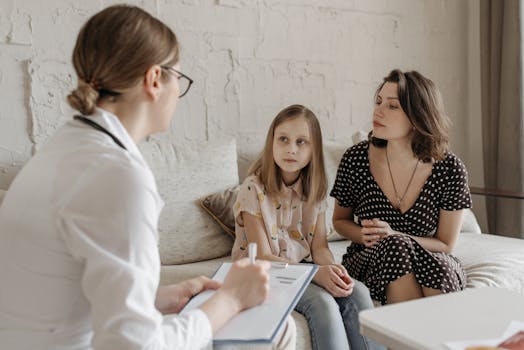 pediatrician consulting with a parent