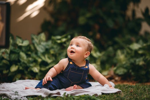 happy toddler sitting on the potty